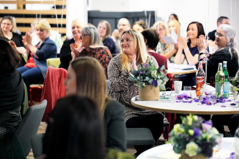 People attending the Inspiring Women Awards applauding one of the winners