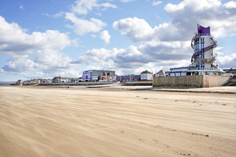 Image of the Redcar beach with the Beacon in the background.