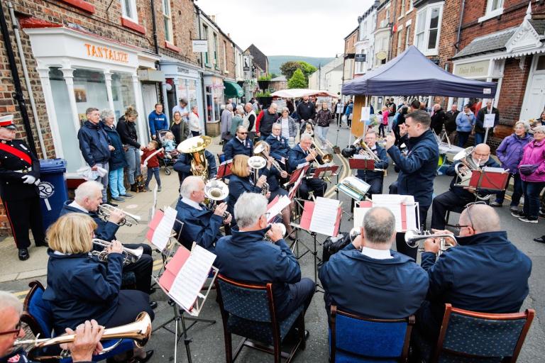 Orchestra singing at the Chaloner Street Market.