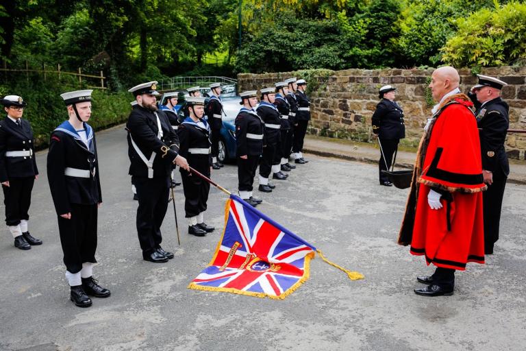 The Mayor Stuart Smith saluting the participants of the parade in Loftus celebrating the Jubilee.