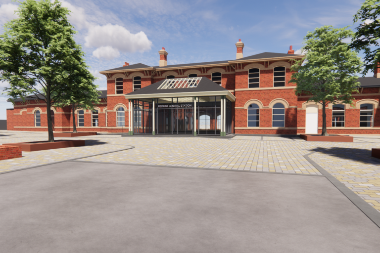 CGI design of the Redcar Central Station from the front, after proposed refurbishments. The image depict a red-bricked building with a glass entrance.
