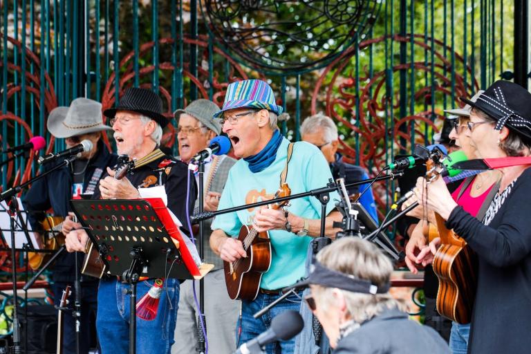 Ukulele performers giving a concert at the Saltburn StandBand.