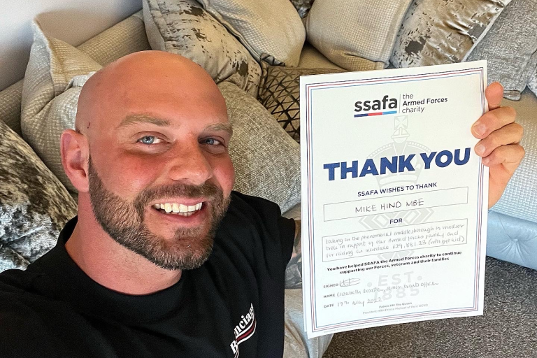 Mike Hide with a thank you certificate from Armed Forces for his donation