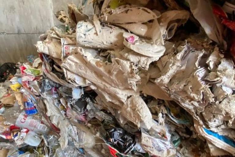 Image of a recycling load covered in paint.