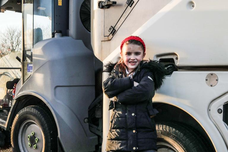 Image of a young girls with the sweeper she named The Trusty Dusty.