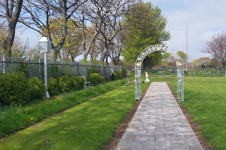 Picture of the Peter Rabbit Garden with the arch and figures