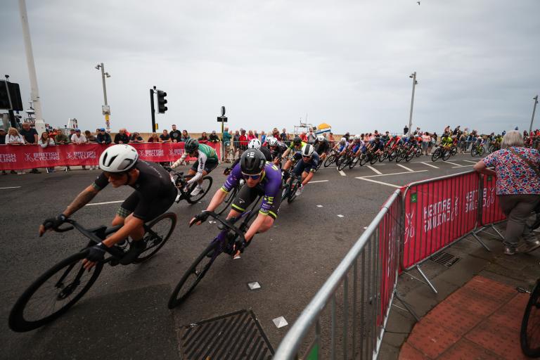 Cyclists speeding through the streets at the Men Circuit Race