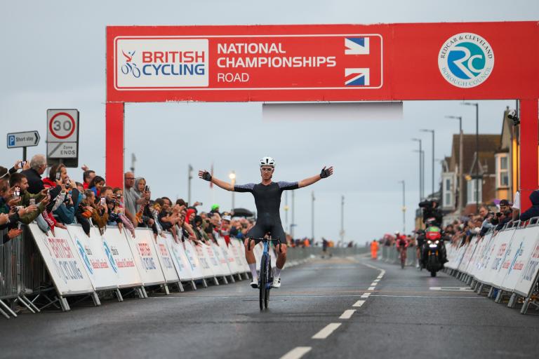 Winner crossing the finish line at Men's Circuit Race.
