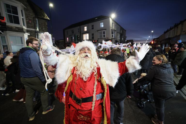 Image of Santa Clause during a night parade on the streets of Redcar.
