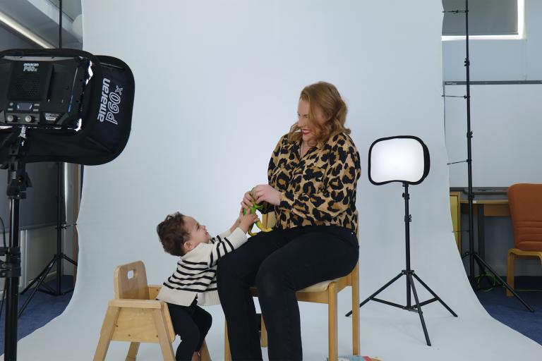 A woman playing with her baby son