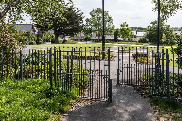 Image shows the entrance to coronation park. The sign reads 'coronation park'