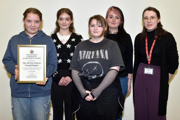 Young people from All our Future Rangers with their award
