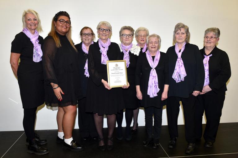 Members of the The Local Vocals Choir from Eston with their award