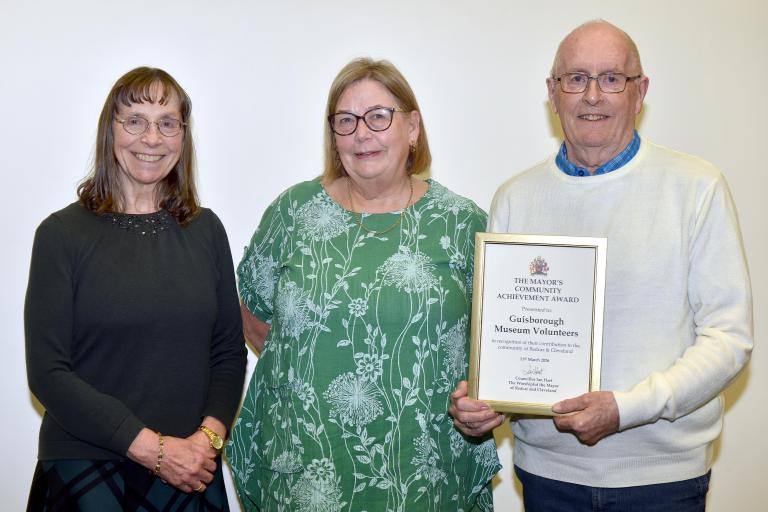 Members of the Guisborough Museum Volunteers with their award