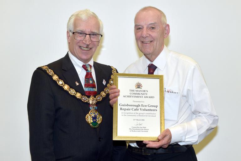 The Mayor giving the award to a representative of the Guisborough Eco Group 