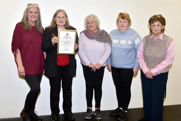 Members of the East Cleveland Good Neighbours with their award