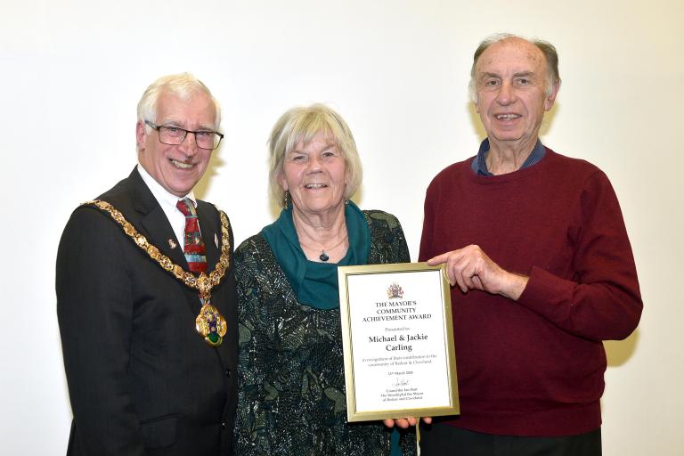 Michael and Jackie Carling with their award