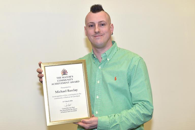 Michael “Mick” Barclay with his award