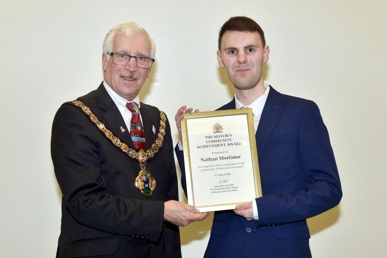 The Mayor presenting the award to Nathan