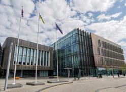 Image of the Civic Centre in Redcar with the three flags flying in front of it.