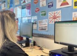 Image of a women looking at a computer screen