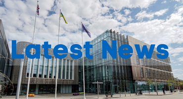 Image of the Redcar Civic Centre, a large building with glass walls, with the words latest news overlaid