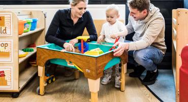 Mother Amber Leighton, of Skelton, with her son Noah and his father Jack Atkinson playing in the sand at the opening of the Skelton family Hub