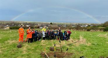 School Children from New Marske Primary, planting trees in the Horsefield Orchard with help and guidance from council officers