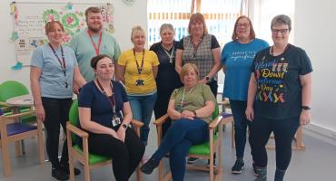 Amanda Mazzey (yellow shirt) with her colleagues from the Activity and Wellbeing Team