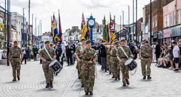 Image shows cadets parading in their uniforms.