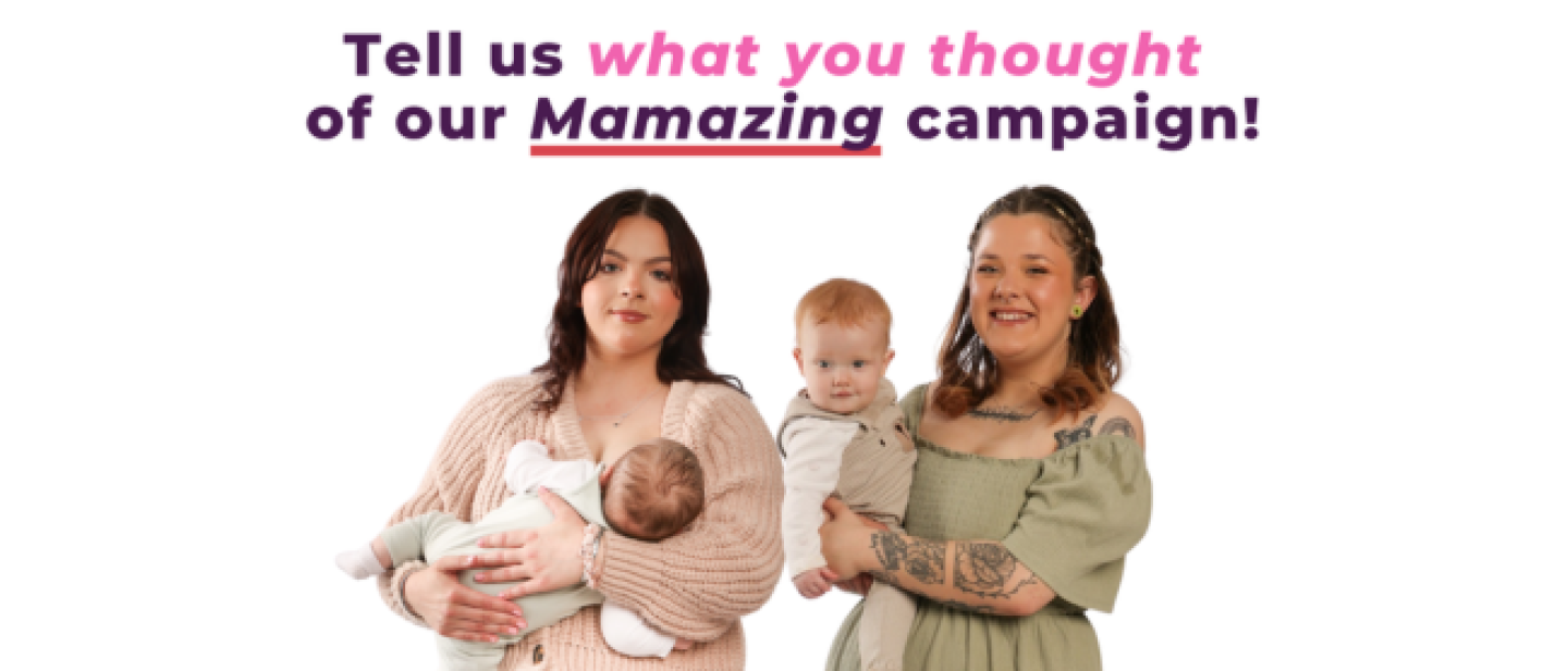 Two women holding babies in their arms and smiling at the camera