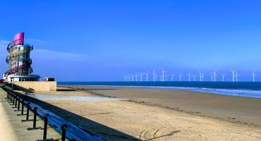 Picture of the Redcar Beach with the Beacon and the windmills in the background